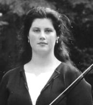 Photograph of Karen Burciaga with bow