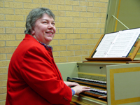 Photograph of Lenora McCroskey at the harpsichord