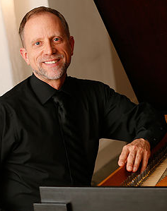 Photograph of Donald Livingston at keyboard