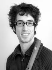 Photograph of Tom Beets holding a recorder