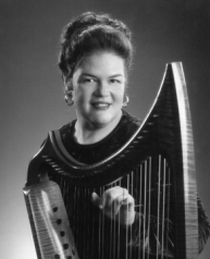 Photograph of Becky Baxter with a harp