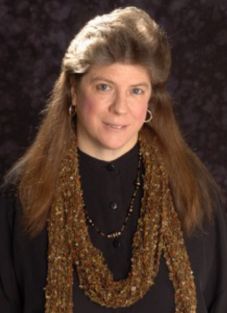 Photograph of Deborah Booth with recorder and flute